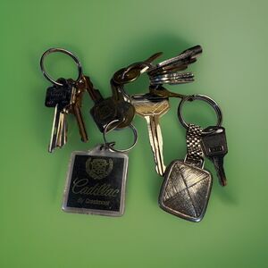 Keychains And Assorted Keys Bundle includes Cadillac And Toyota